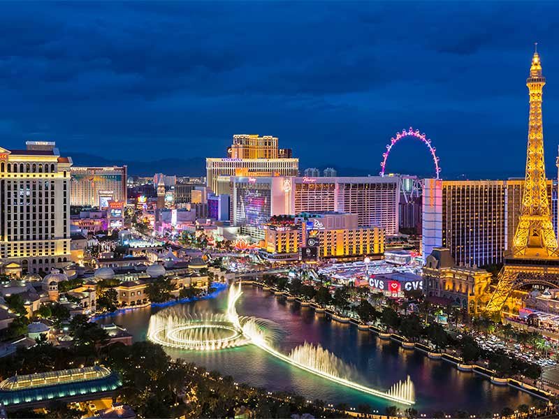 USA, Nevada, Las Vegas, Strip, fountain, hotels and Eiffel Tower at blue hour