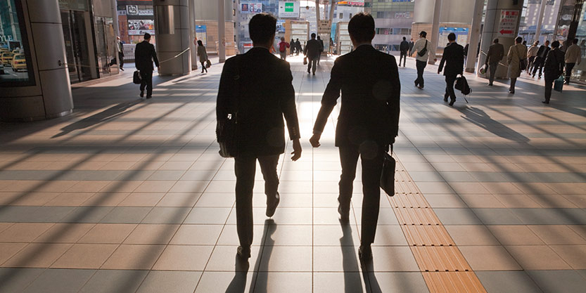 two businessmen walking