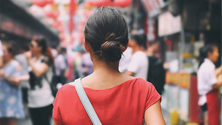 Tourist walking in city streets on Asia vacation tourism