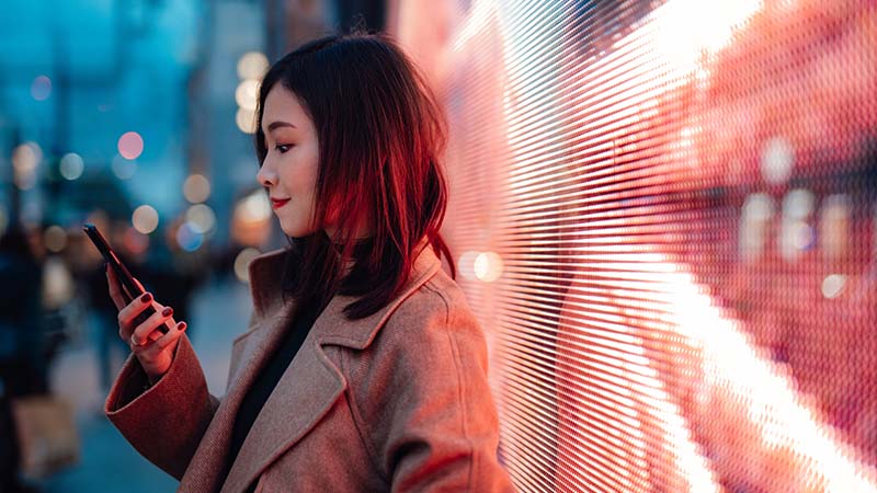 A woman is checking the phone