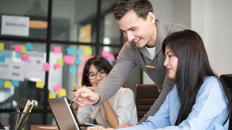 A small team discussing in office