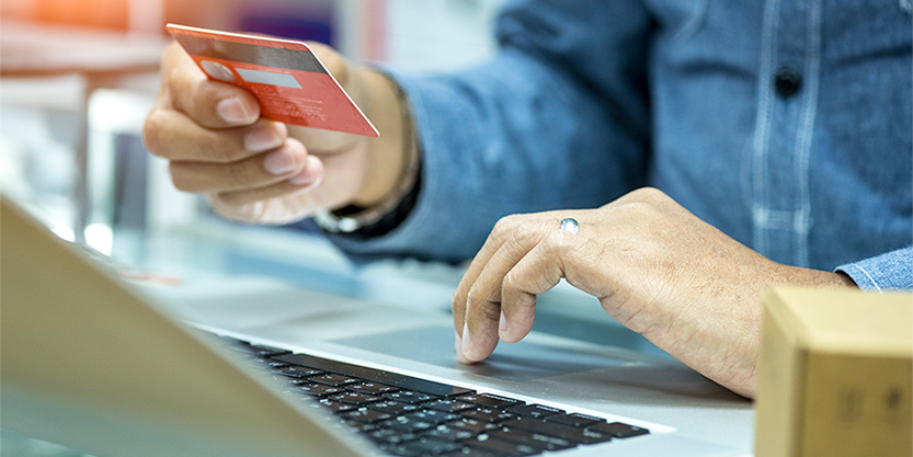 Man using his credit/debit card for online payment