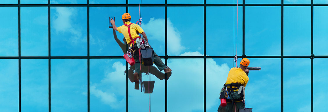 Two people cleaning the building
