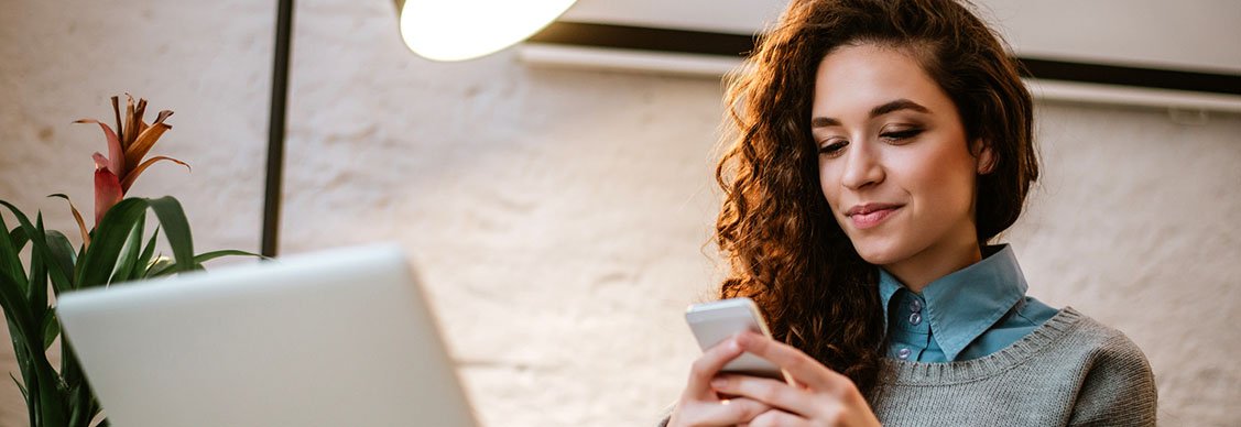 Woman is looking into mobile