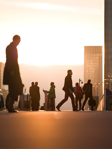 Commuters walking to office on a cold sunny day