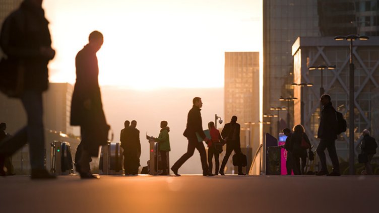 Commuters walking to office on a cold sunny day