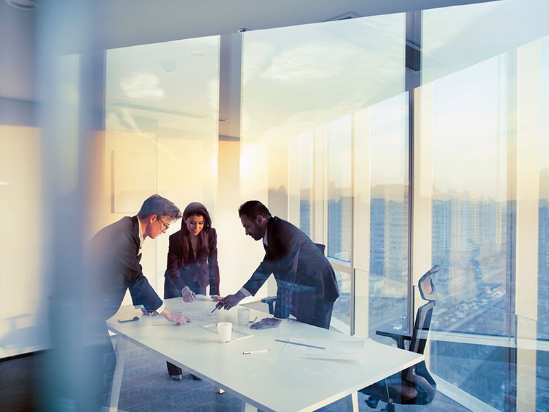 Employees working in meeting room