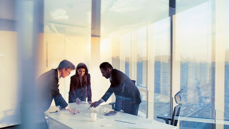 Employees working in meeting room