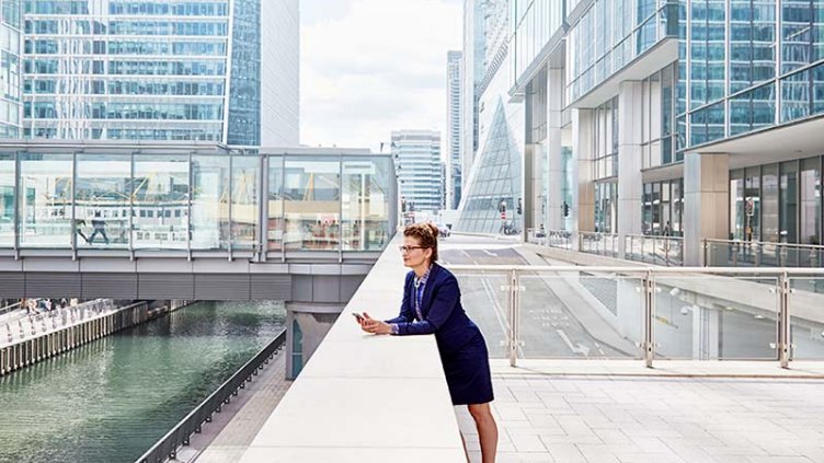 Woman standing among buildings in a special economic zone