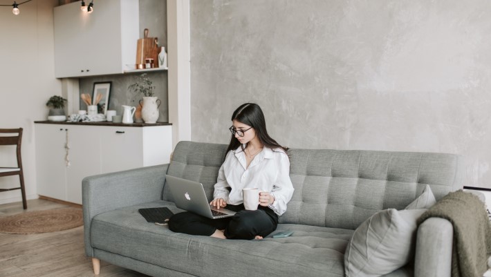 woman sitting on sofa