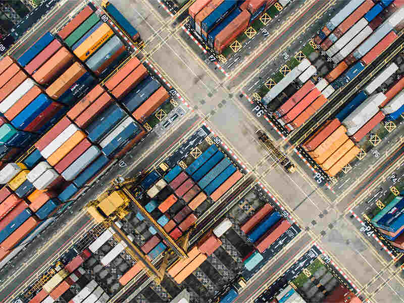 Aerial view of cargo truck parking in logisitics warehouse