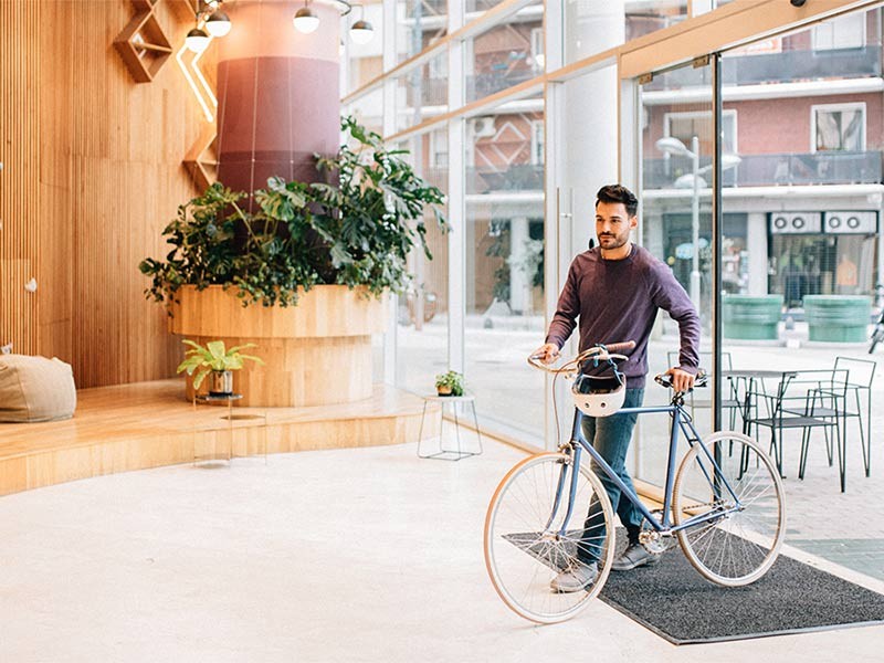 Walking in office with cycle