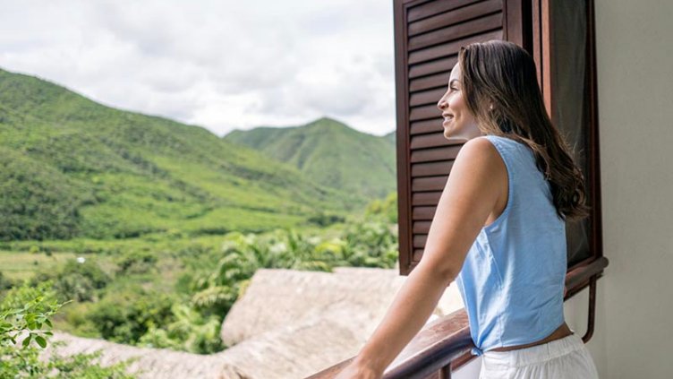 Women watching mountains from window