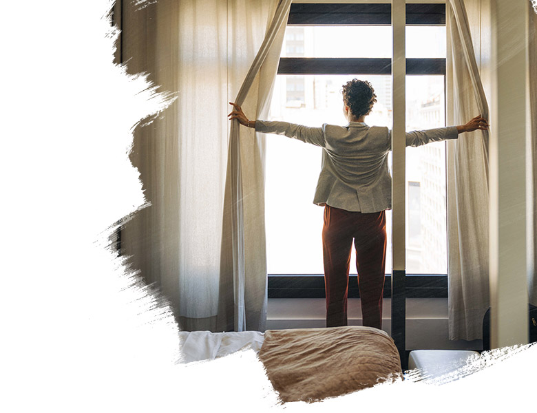 person standing near a glass wall