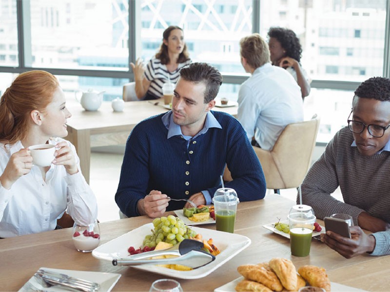 Employees having a lunch in a break time in  Cafeteria