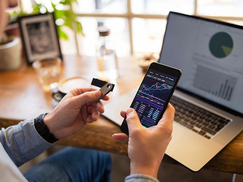 Man using mobile and laptop