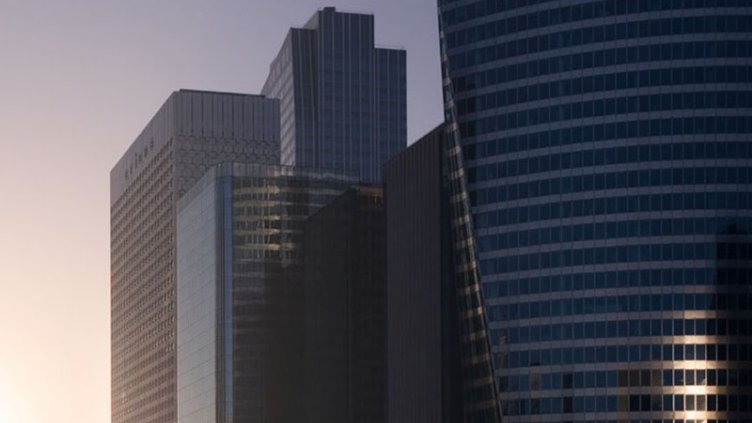 Office goers walking past a commercial complex