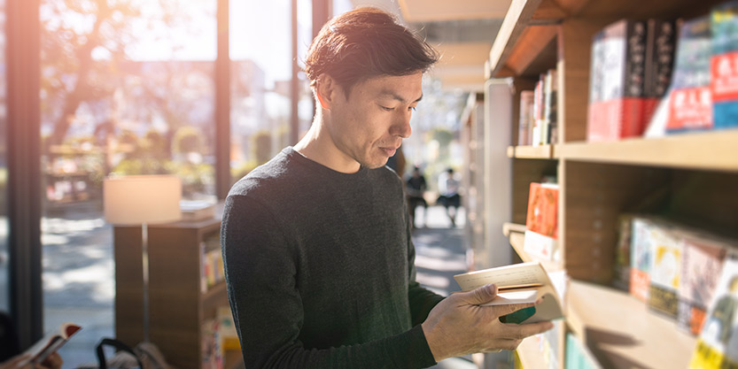 Men reading a book 