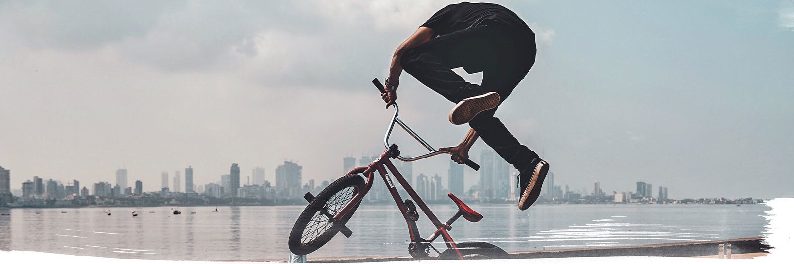 BMX rider doing tricks in the streets