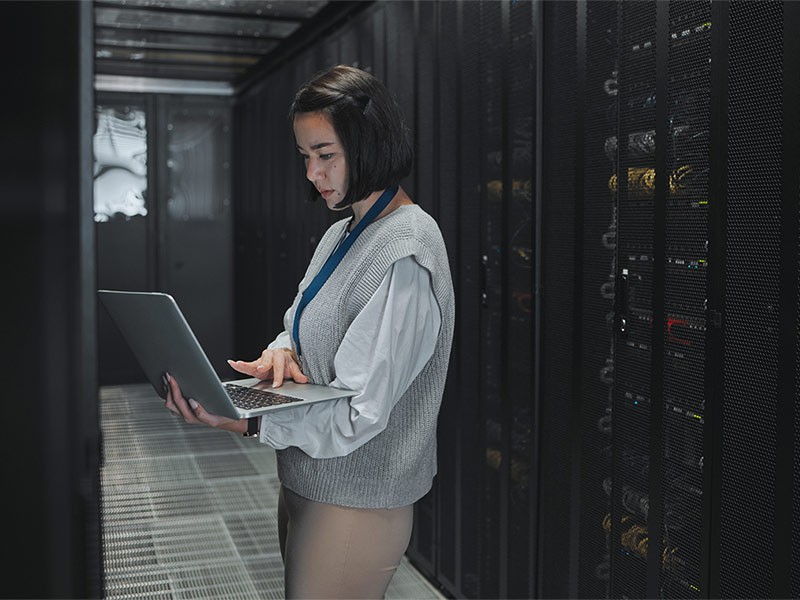 A young girl working on laptop