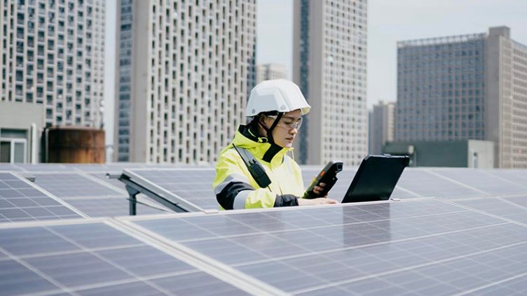 A professional girl observing the reading of Solar Panel 