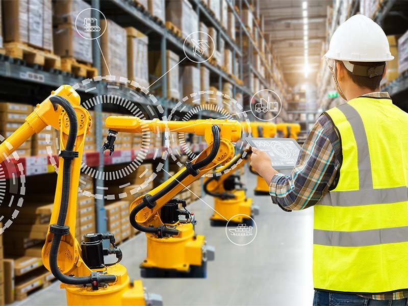 A professional man holding Tablet inside a warehouse