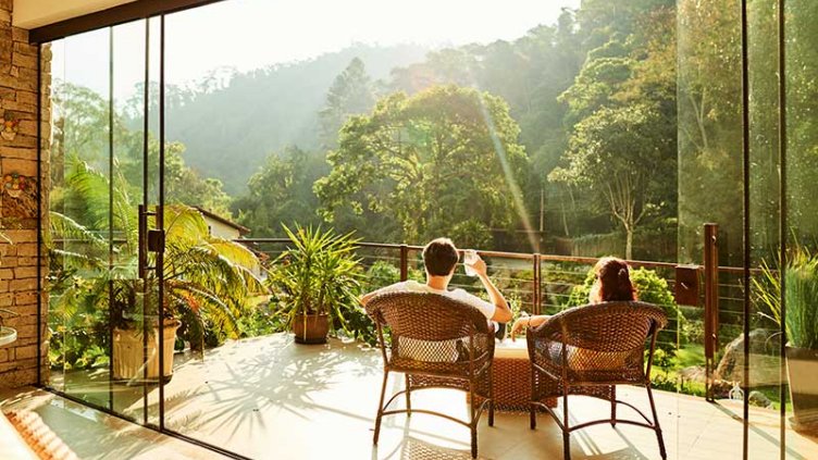 A couple having coffee while sitting