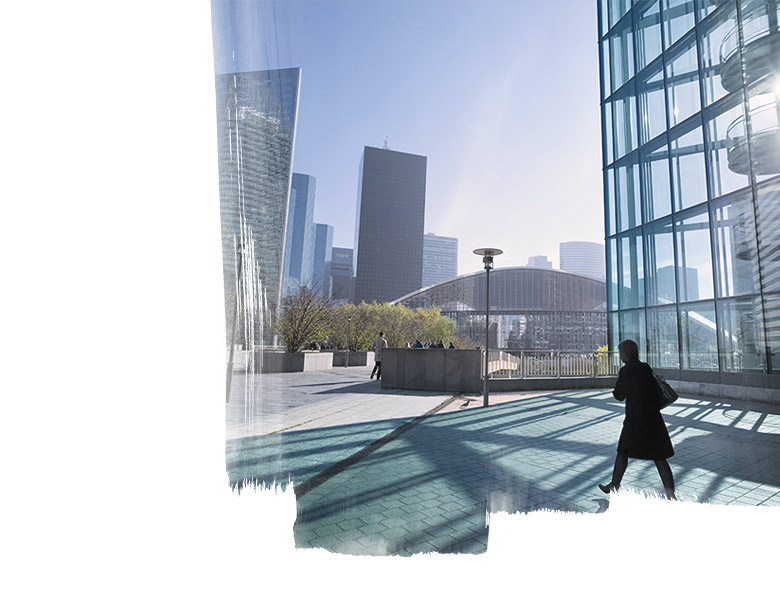 A women walking outside office building