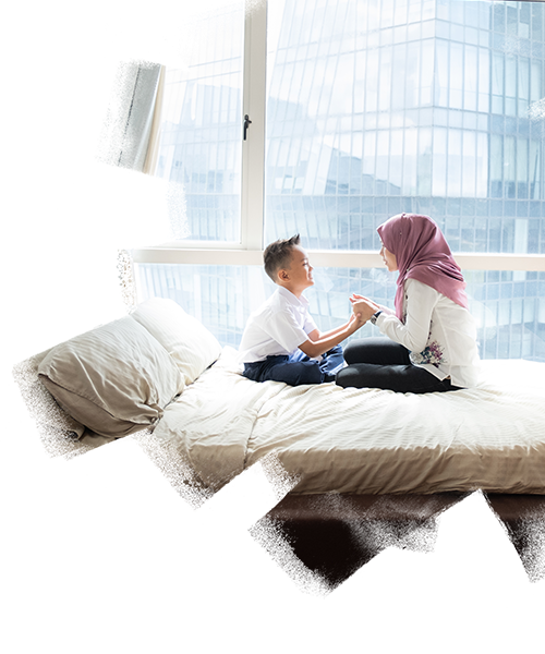 A woman with her kid sitting on the bed inside her house