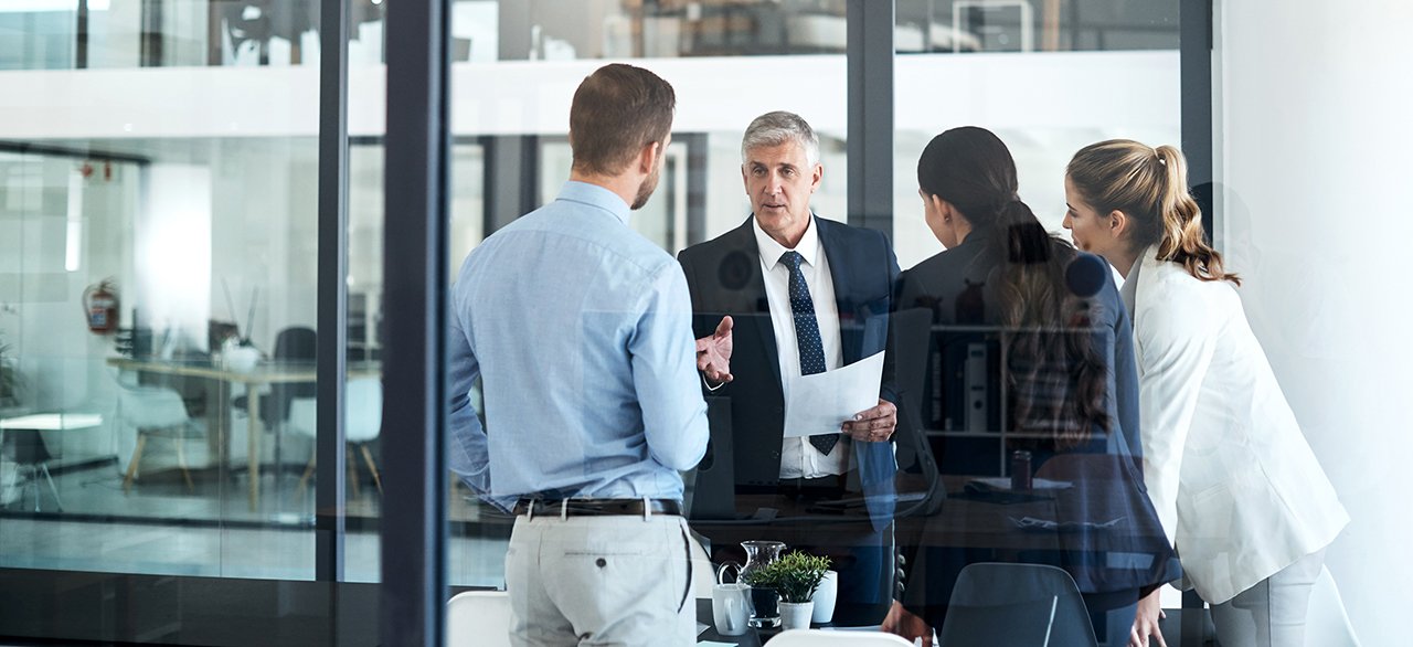 Picture of a team manager assigning important tasks to his team members