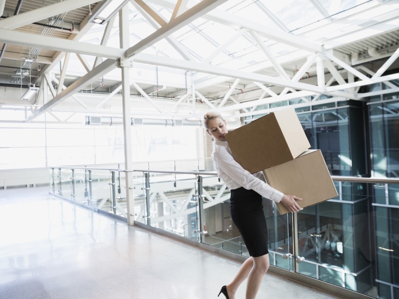 Woman carrying boxes