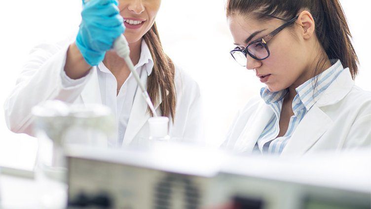 Lab assistants evaluating new test methods in the laboratory